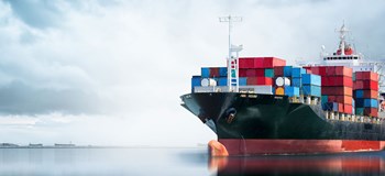 An image of a shipping container at sea